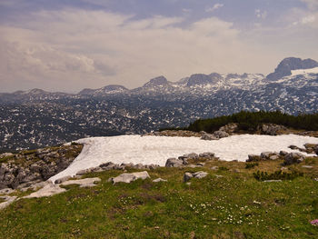 Scenic view of landscape and mountains against sky