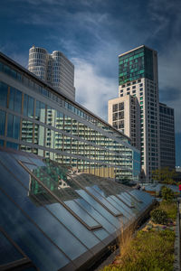 Modern buildings against sky in city
