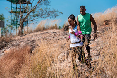 Couple running on mountain