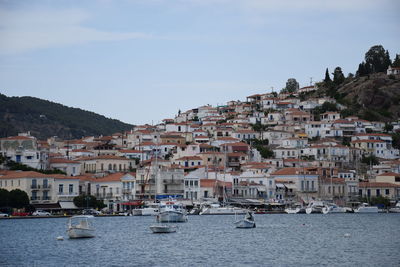 Townscape by sea against sky