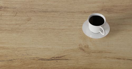 High angle view of coffee cup on table