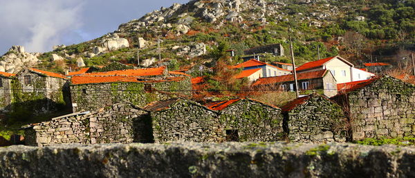 Typical portuguese  ancient mountain houses in a mountain village  against sky