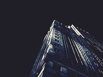 Low angle view of modern building at night