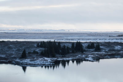 Scenic view of sea against sky during winter