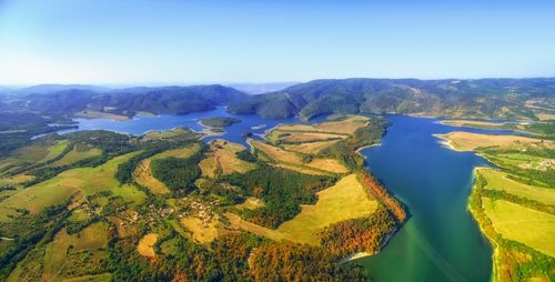 Panoramic view of mountains against clear blue sky