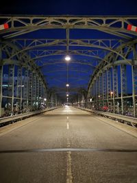 Surface level of road along bridge at night