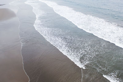 High angle view of water flowing over sea