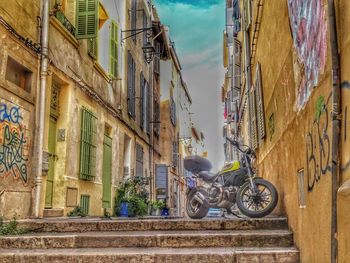 Bicycles against sky in city