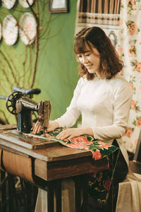 Young woman sitting on table