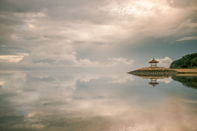 Digital composite image of birds flying over water