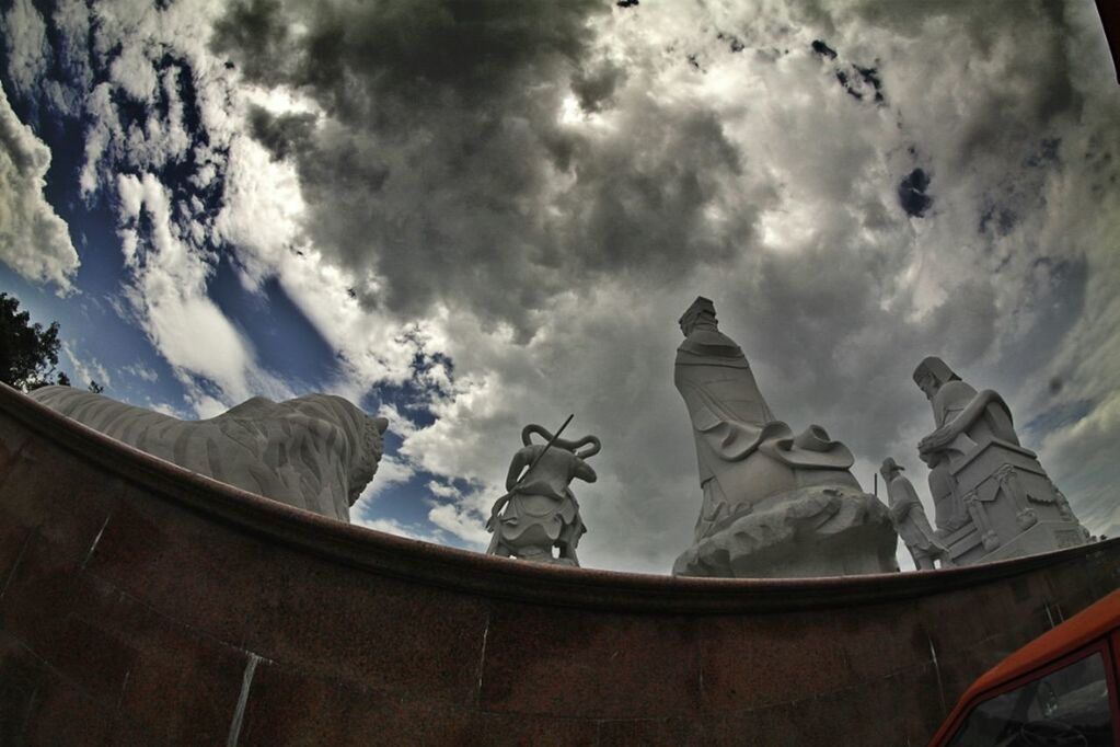 sky, cloud - sky, art and craft, cloudy, art, sculpture, low angle view, statue, built structure, architecture, human representation, creativity, cloud, religion, no people, spirituality, day, history, animal representation