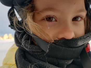 Close-up portrait of girl in winter