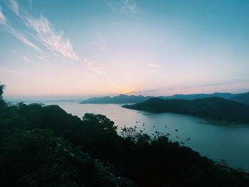 Scenic view of lake against sky during sunset