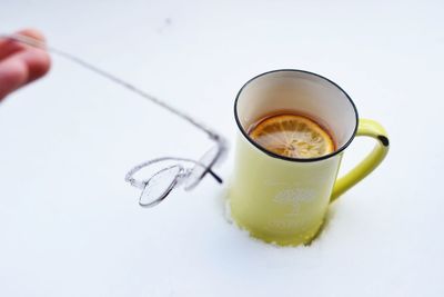 Close-up of coffee cup over white background