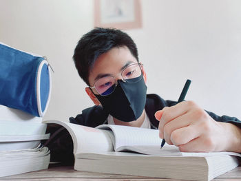 Young man doing homework 