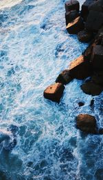 High angle view of rocks in sea