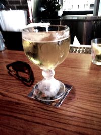 Close-up of wine glasses on table