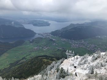 High angle view of land and mountains against sky