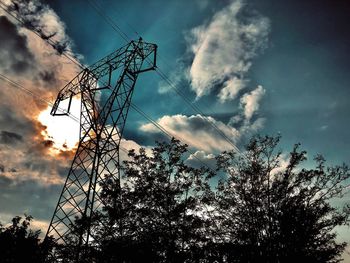 Low angle view of silhouette tree against sky