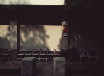 Empty chairs against wall