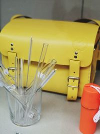 High angle view of yellow glasses on table