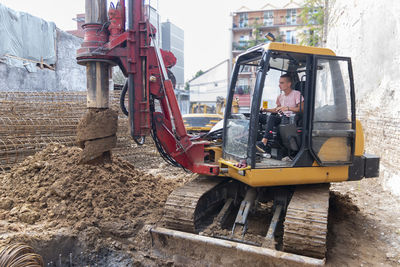 Hydraulic bore pile rig machine at the construction in the foundations.