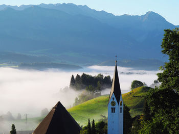 Panoramic view of building and mountains against sky