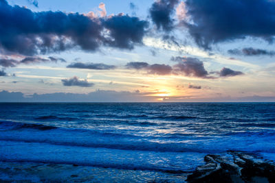 Scenic view of sea against sky during sunset