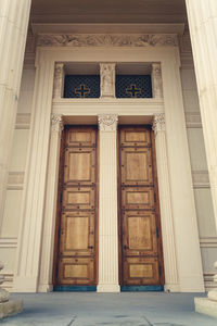 Low angle view of closed door of old building