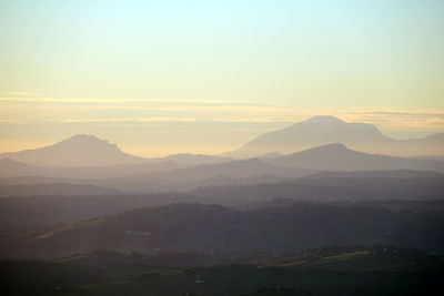 Scenic view of mountains against sky during sunset