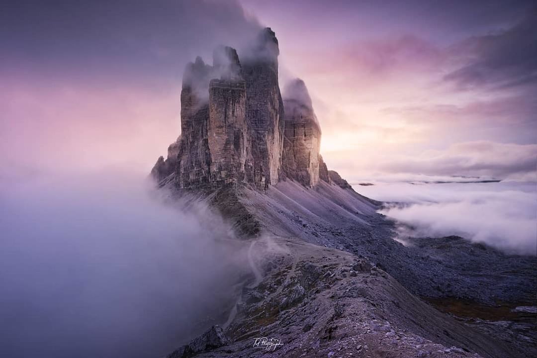 beauty in nature, scenics - nature, sky, rock, nature, solid, cloud - sky, rock - object, tranquility, water, tranquil scene, no people, non-urban scene, fog, mountain, environment, rock formation, landscape, power in nature, purple, mountain peak