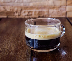 Close-up of coffee cup on table