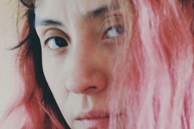 Close-up portrait of woman with dyed hair