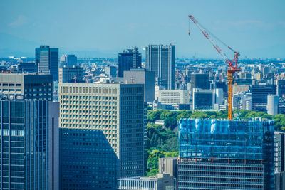 Modern buildings in city against clear sky