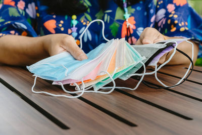 Low section of man working on table