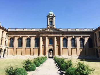 Facade of historic building against clear blue sky