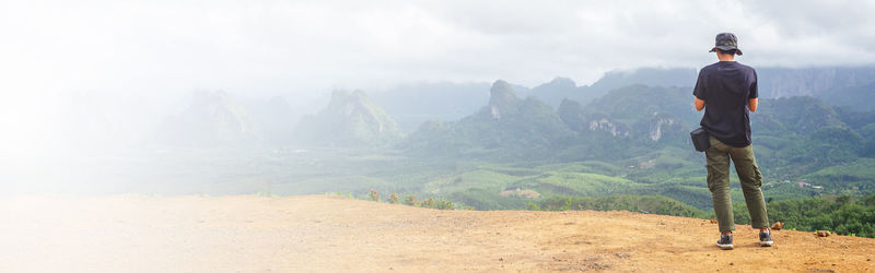 Solo traveller enjoying beautiful nature of hills. web banner size.