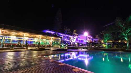 Illuminated fountain at night