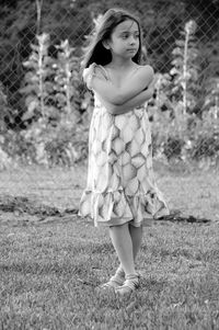 Full length of teenage girl standing on field