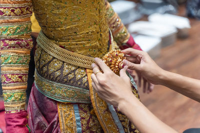 Close-up of hand holding cross