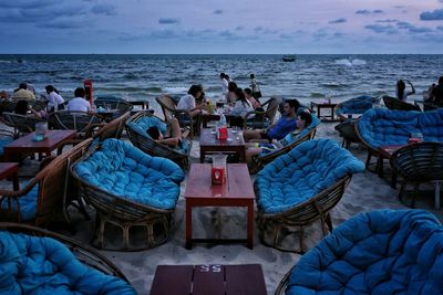 Tourists at outdoors restaurant on beach