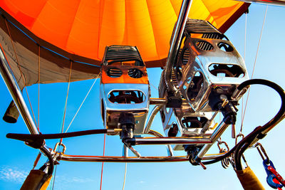 Low angle view of cable cars against sky