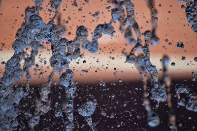 Full frame shot of water drops on window