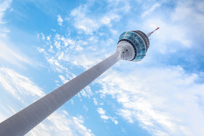 Low angle view of tower against cloudy sky