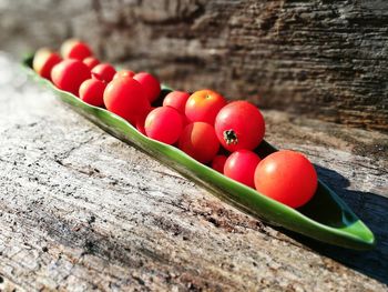 High angle view of tomatoes on wood