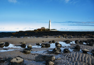 Scenic view of shore against sky