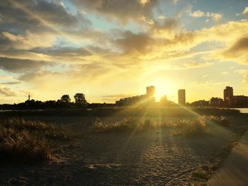 Scenic view of sunset over city