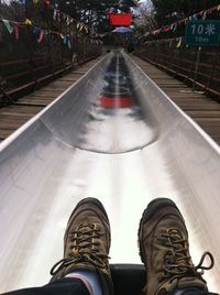 Riding a slide in china.