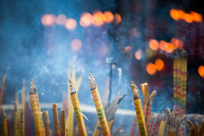 Close-up of incenses at temple