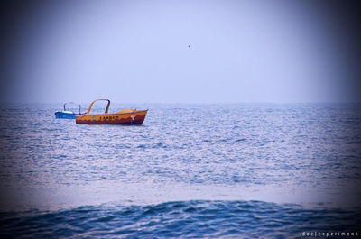 Ship in sea against clear sky